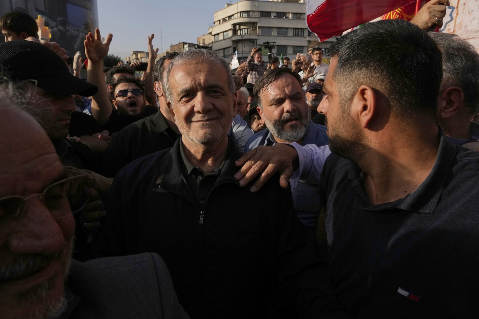 Iranian President Masoud Pezeshkian attends a protest following the U.S. attacks on nuclear sites in Iran, in Tehran, Iran, Sunday, June 22, 2025. (AP Photo/Vahid Salemi)