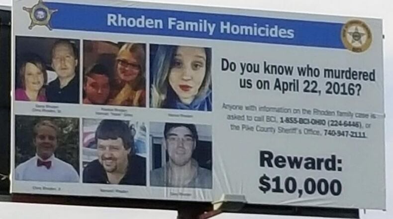 Crews installed a billboard on Ohio  23 north in Waverly, near the Pike County Sheriff's Office, in advance of the one-year anniversary of the Rhoden family murders on April 22, 2016. The billboard promotes the $10,000 reward for information leading to a conviction in the eight unsolved homicides. The billboard company donated the space, and Sheriff Charles Reader used Furtherance of Justice funds from his office to cover the cost. Holly Zachariah /The Columbus Dispatch