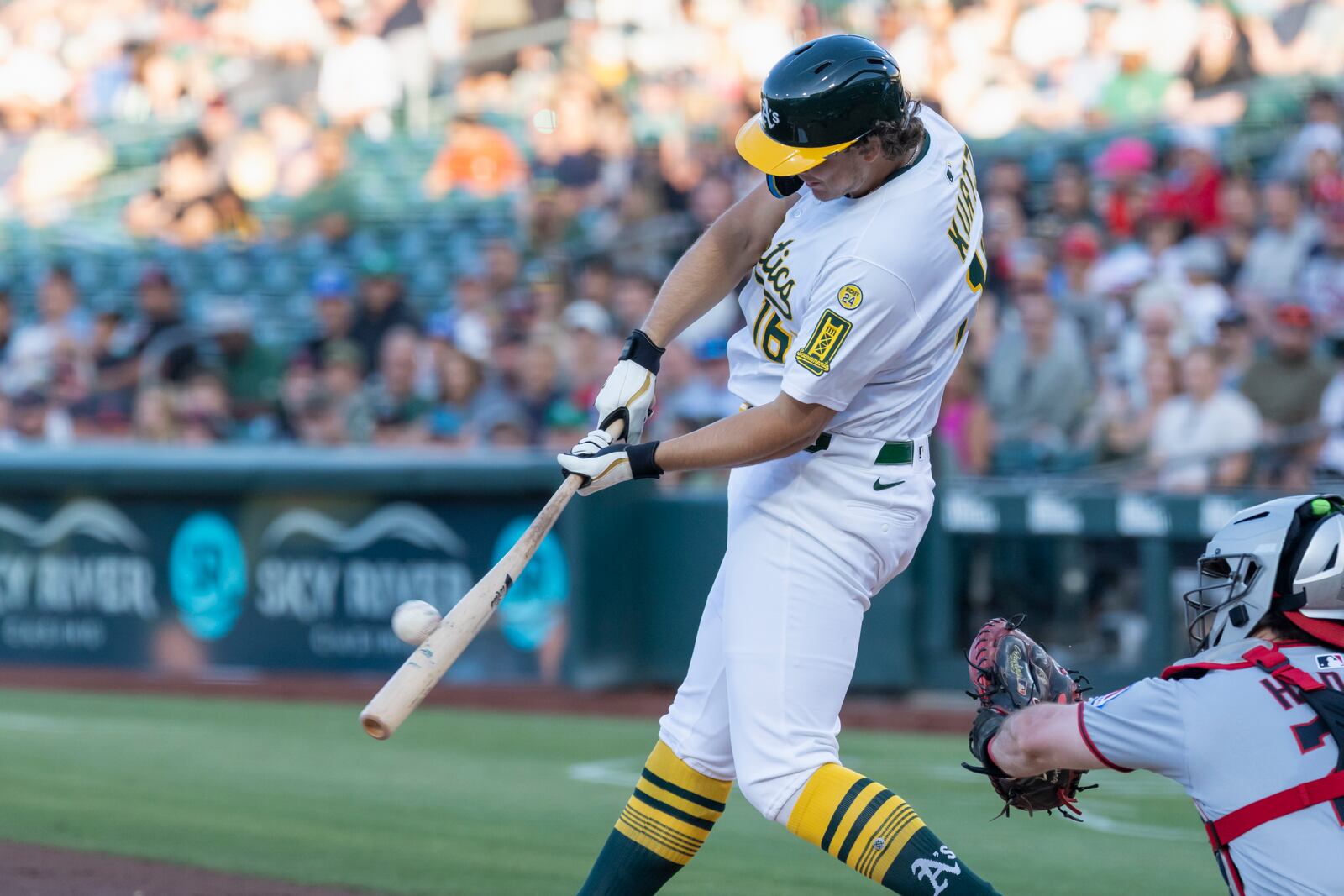 Athletics' Nick Kurtz hits a two-run home run during the first inning of a baseball game against the Cleveland Guardians, Friday, June 20, 2025, in West Sacramento, Calif. (AP Photo/Sara Nevis)
