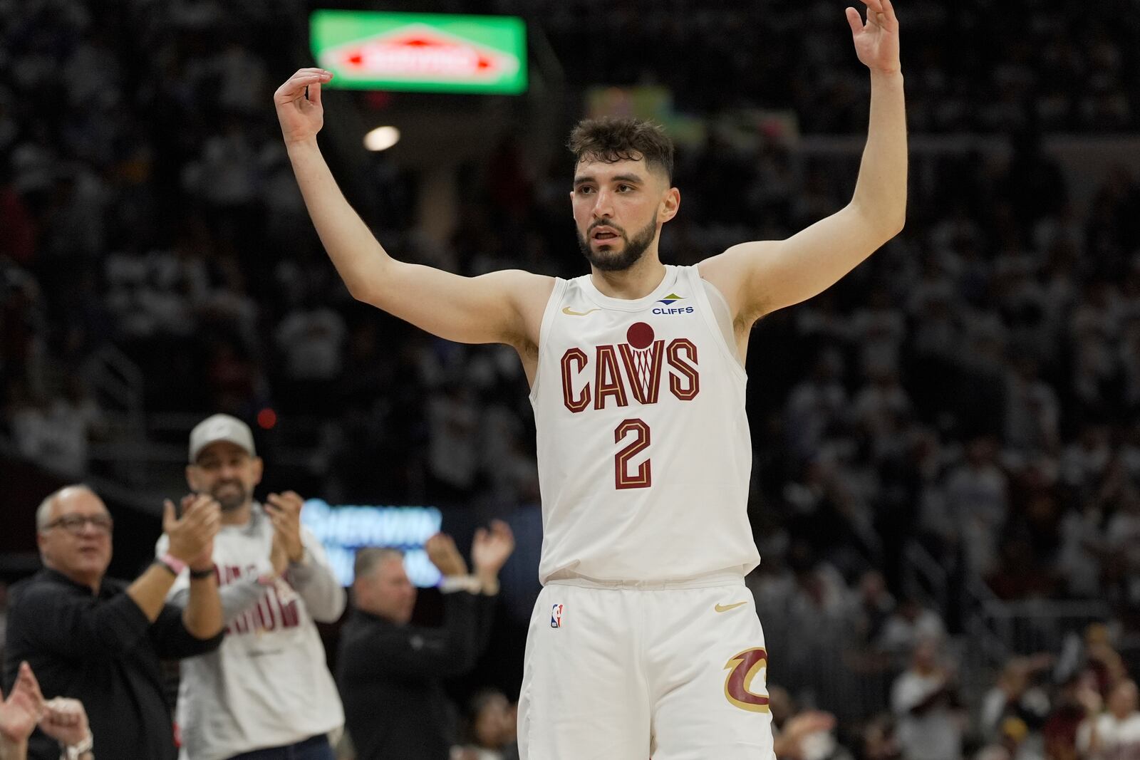 Cleveland Cavaliers guard Ty Jerome (2) gestures to fans in the second half in Game 1 of an NBA first-round playoff series against the Miami Heat, Sunday, April 20, 2025, in Cleveland. (AP Photo/Sue Ogrocki)
