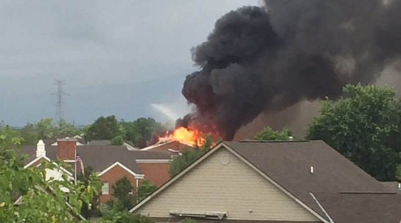 Heavy black smoke and flames were visible coming from an apartment building Saturday evening at the Mount Pleasant Retirement Village in Monroe. (DeAngelo Byrd/Staff)