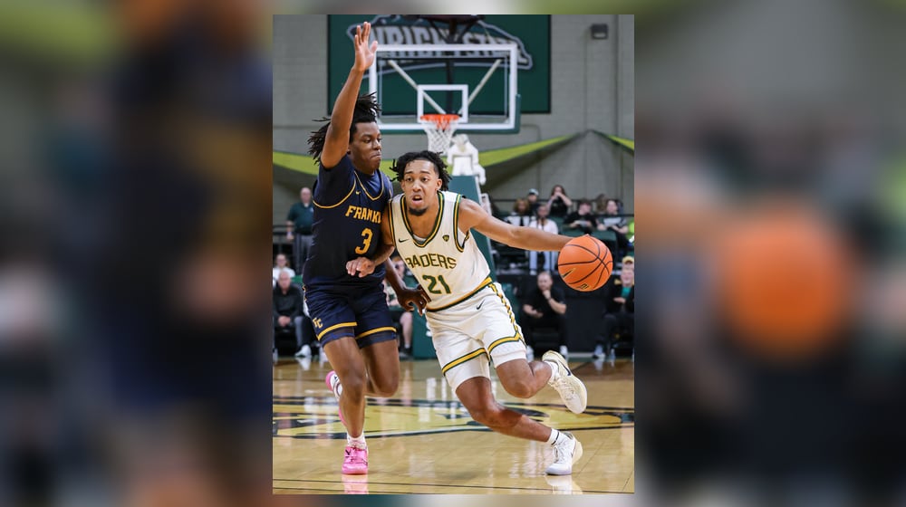 Wright State junior guard Logan Woods dribbles with pressure from Franklin College's Rohan Pearson during a season opener on Monday, Nov. 3 at Ervin J. Nutter Center in Fairborn. BRYANT BILLING/STAFF
