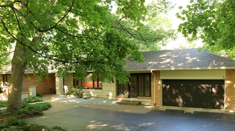 The brick-and-cedar ranch, with about 2,835 sq. ft. of living space, sits on a half-acre lot with detailed landscaping with cedar-and-stone pathways. Large Pella windows bring nature inside and complement the wood flooring, cabinetry and open floor plan.
CONTRIBUTED PHOTO BY KATHY TYLER