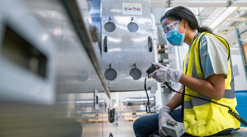 Lauren Poellnitz, a process engineer at Silfex, works inside the company's facility in Springfield that is on Titus Road. That location now boast a workforce of over 500 people, surpassing original growth expectations. Mark Schmitter, Contributed.