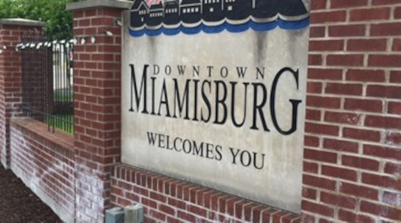 Four candidates are vying for three Miamisburg City Council at-large seats today in a race that includes two incumbents and a pair of challengers.