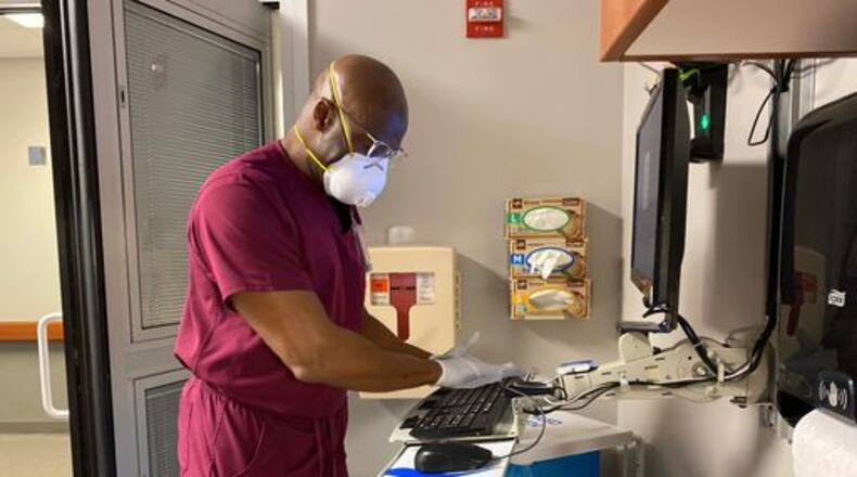 Derrek Thomas, 56, who has worked at Atrium Medical Center in Middletown for nine years, is participating in the hospital's Helping Hands program. He has worked outside the radiology department. ATRIUM MEDICAL CENTER PHOTO