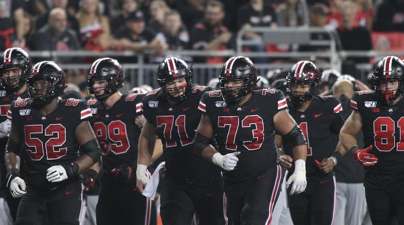 Ohio State offensive linemen, including Josh Myers (71), run to a huddle during a game against Michigan State on Saturday, Oct. 5, 2019, at Ohio Stadium in Columbus. David Jablonski/Staff