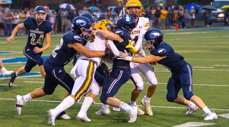 Alter's Noah Jones is stopped by Fairmont during Thursday night's game at Roush Stadium. Jeff Gilbert/CONTRIBUTED
