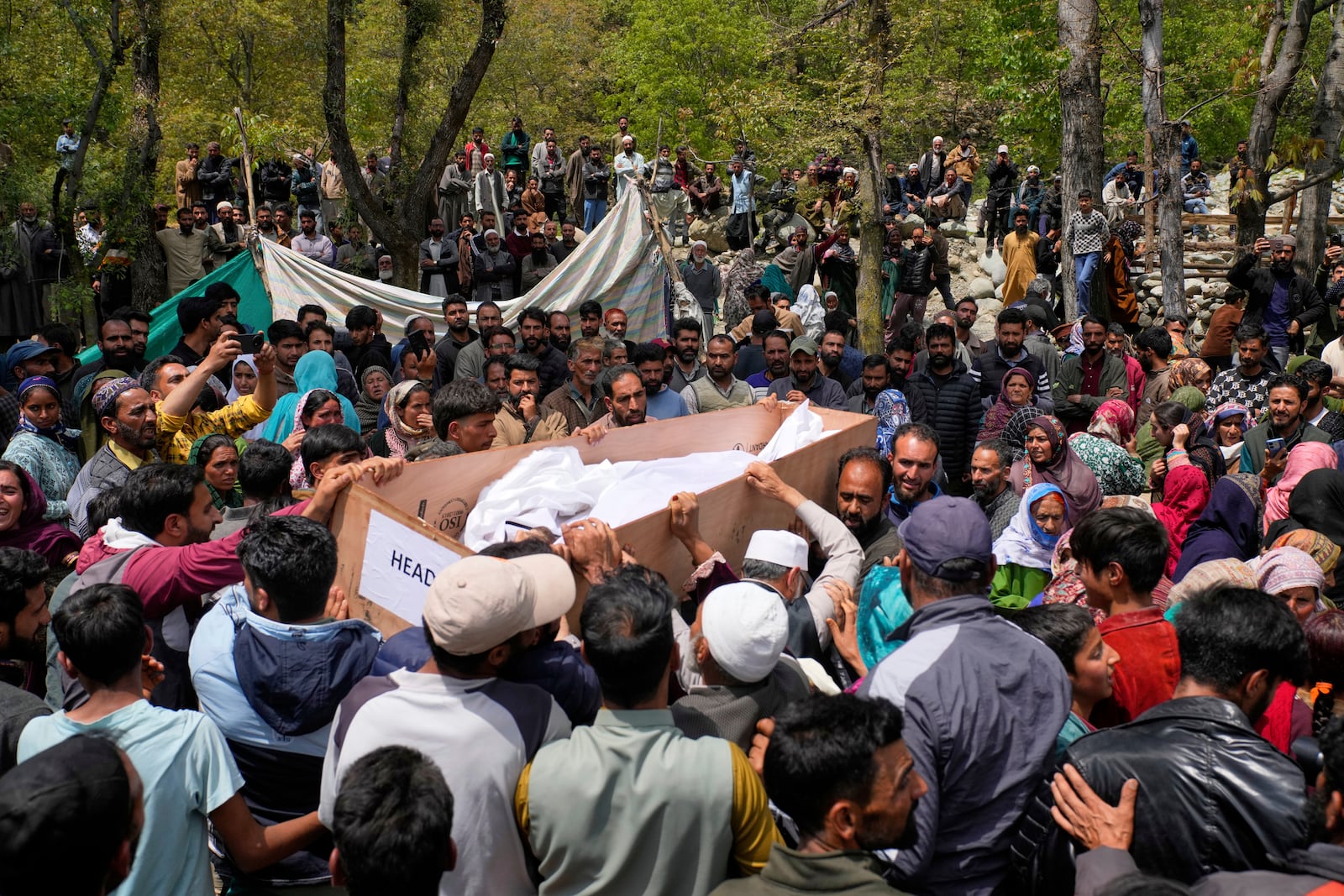 The body of Adil Hussain Shah, a daily-wage worker, who was killed when militants indiscriminately opened fire on a crowd of mainly tourists on Tuesday, is carried for burial at his village Hapatnar, about 20 km (13 miles) from Pahalgam where the incident took place, Indian controlled Kashmir, Wednesday, April 23, 2025. (AP Photo/Dar Yasin)