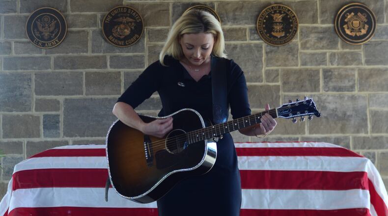 Country singer/songwriter Karen Waldrup honors World War II veteran Jim "Pee Wee" Martin with a performance of "Normandy" at his celebration of life and graveside service Wednesday, Sept. 21, 2022. Photo courtesy Ron Kaplan