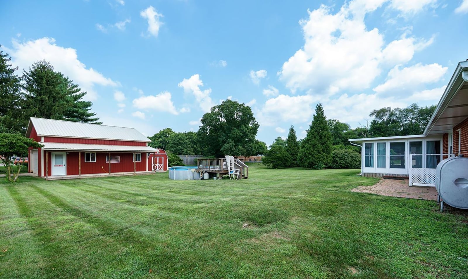 The nearly 3/4 acre lot is completely fenced and features a pole barn and storage shed as well as an above ground pool with deck. CONTRIBUTED
