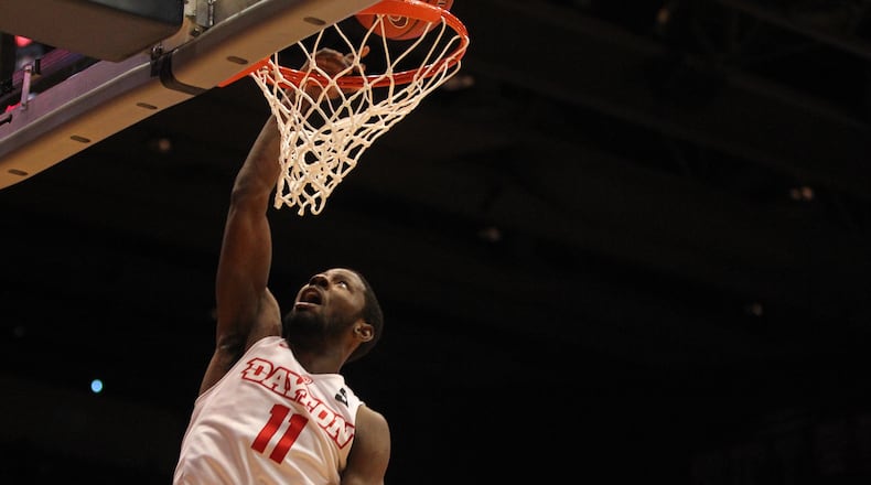 Scoochie Smith dunks against Rhode Island on Friday. David Jablonski/Staff