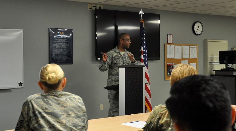 Master Sgt. Kevin Alexander, Mission Support superintendent, Air Force Office of Special Investigations, who is Toastmasters area director, evaluates a speaker during a club meeting on Wright-Patterson Air Force Base June 4. The Wright Way Toastmasters meet every first and third Tuesday of the month at noon in the Wright-Patterson Medical Center. (U.S. Air Force photo/Karina Brady)