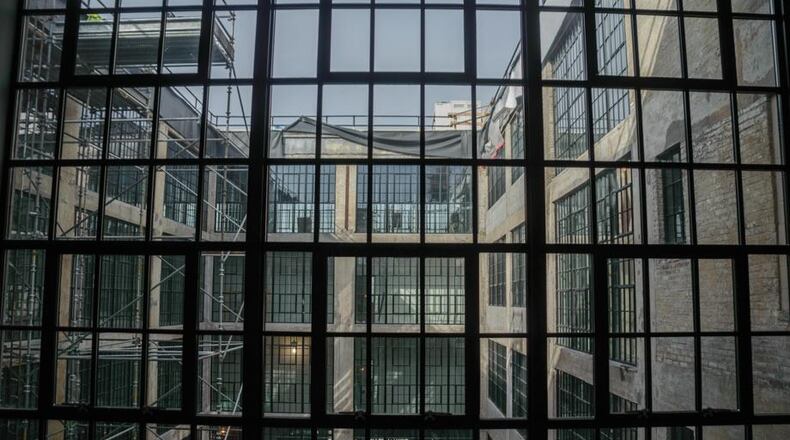 A photo of the windows at the Delco Lofts, which are part of the Water Street district. TOM GILLIAM / STAFF