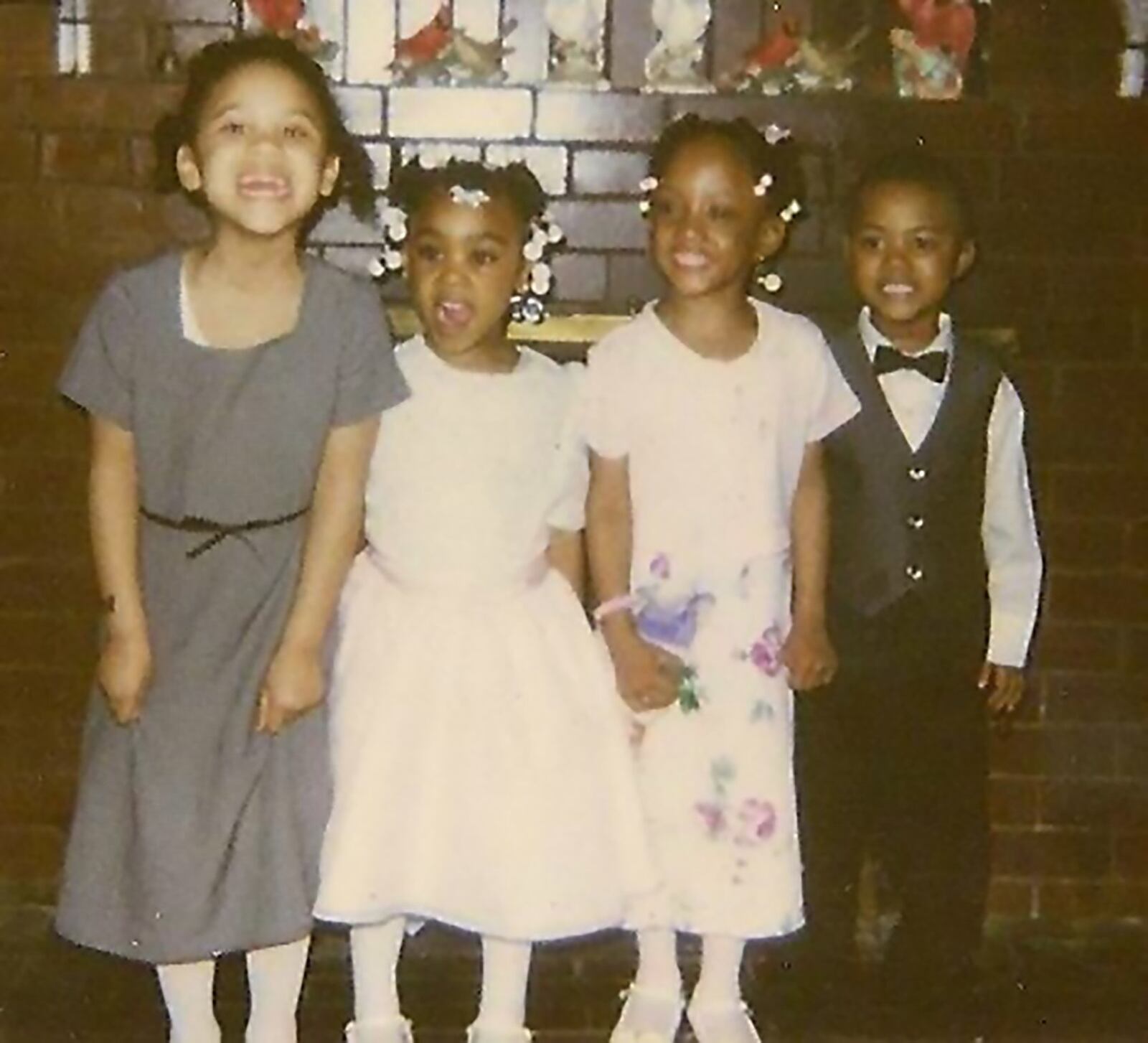 Ja’ cole Tabor , Brittaney Jefferson and two more cousins, Courtney Foreman and Blair King, pose as little kids growing up in Dayton. (part of story of Ja’Cole and Brittaney will be their growing up in Dayton and being pals since birth. CONTRIBUTED PHOTO