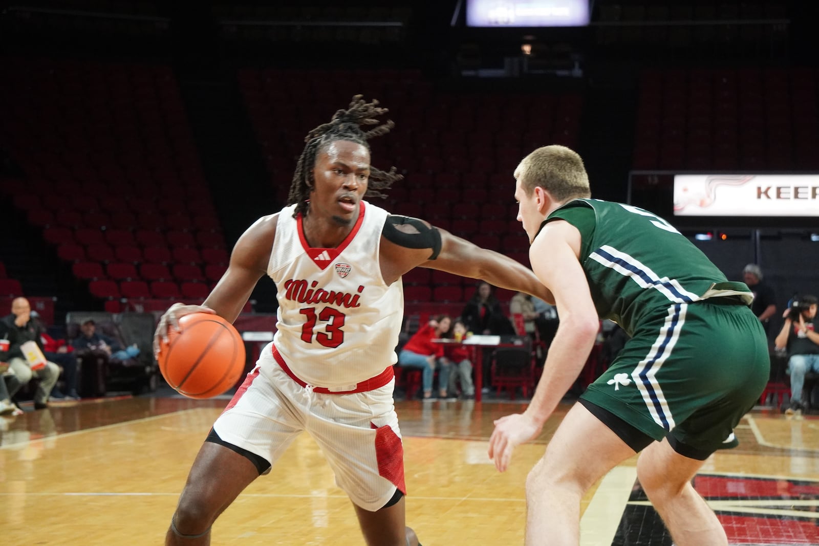 Miami’s Antwone Woolfolk dribbles the ball against Mercyhurst on Thursday night at Millett Hall. CHRIS VOGT / CONTRIBUTED