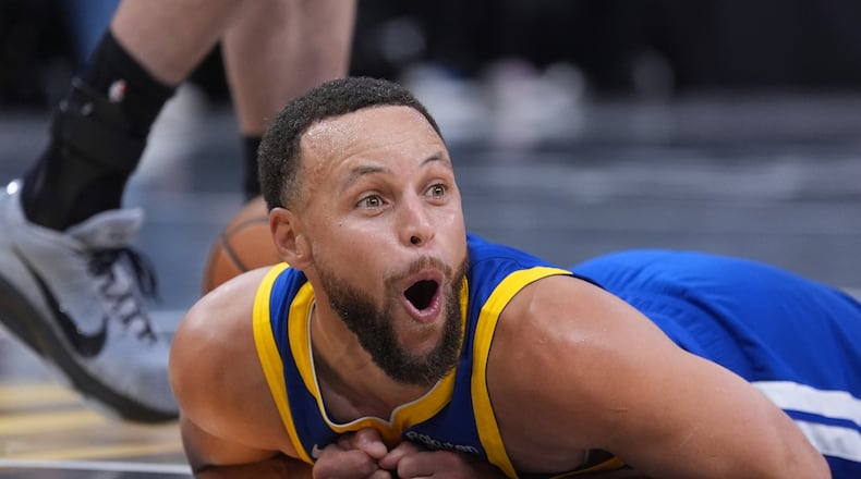 Golden State Warriors guard Stephen Curry (30) reacts after he was fouled during the second half of an NBA Cup basketball game against the San Antonio Spurs in San Antonio, Friday, Nov. 14, 2025. (AP Photo/Eric Gay)