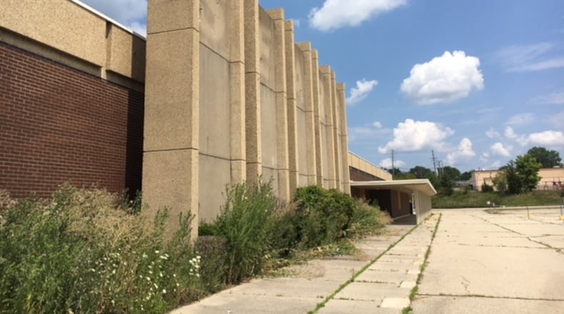 This worn facade was once the front of the Sears store which at one time anchored the Salem Mall, a mall which no longer exists. THOMAS GNAU/STAFF