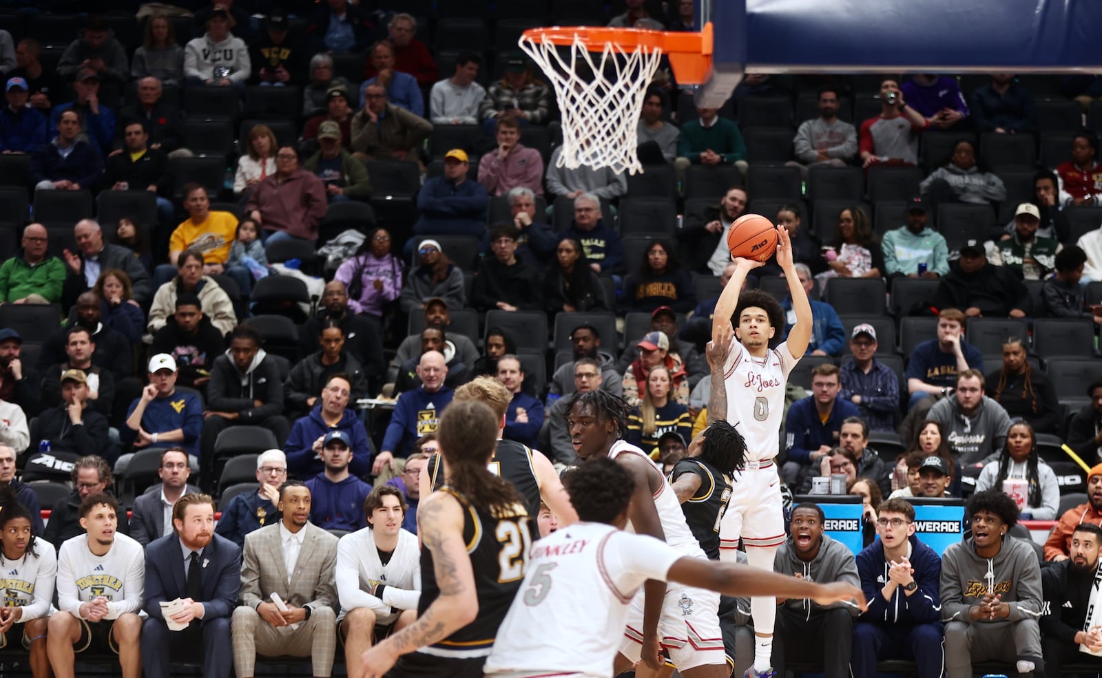 Derek Simpson, of Saint Joseph's, shoots against La Salle in the second round of the Atlantic 10 Conference tournament on Thursday, March 13, 2025, at Capital One Arena in Washington, D.C. David Jablonski/Staff