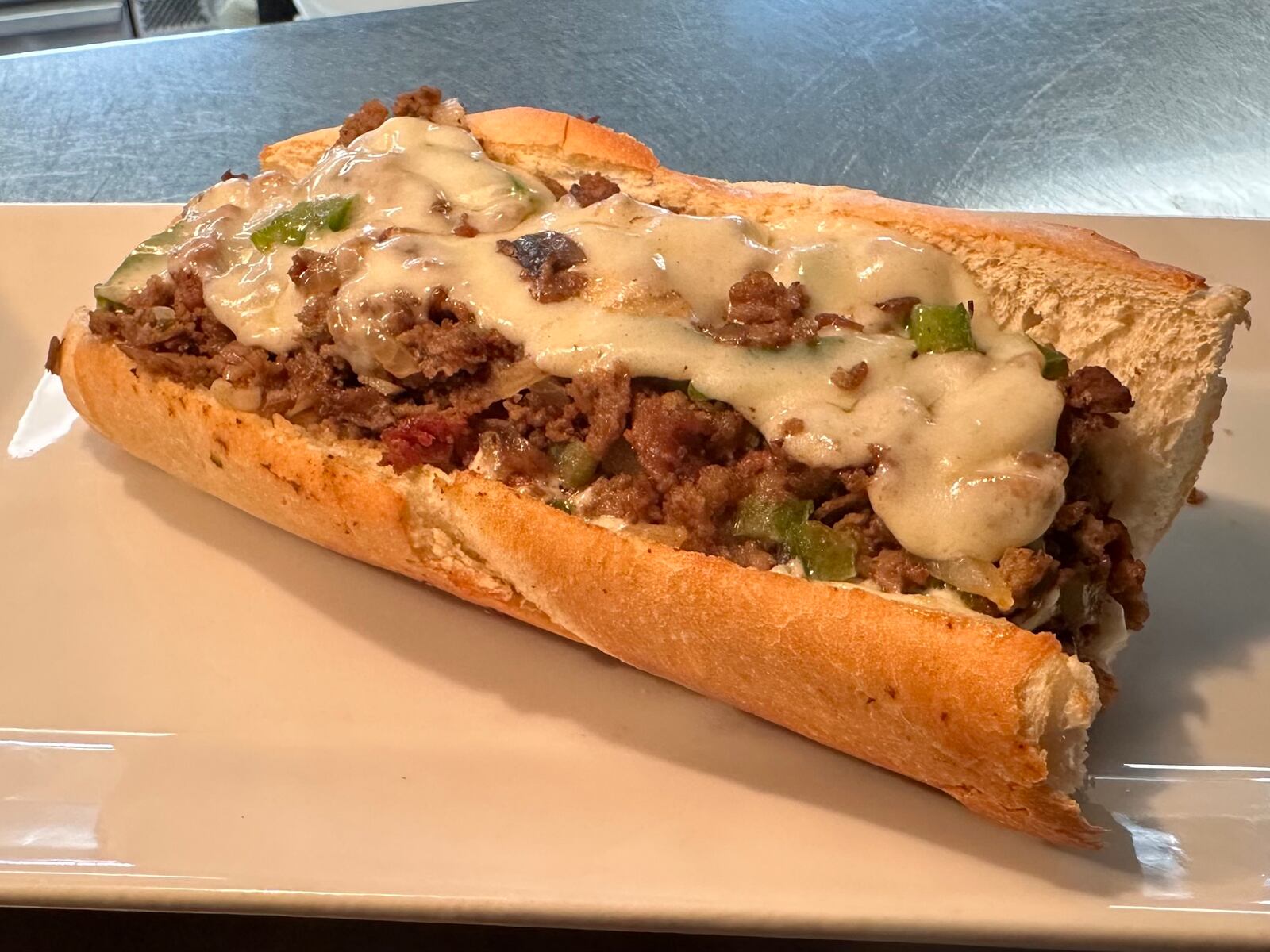 Steak Thyme Bar & Grill, located at 103 N. Springboro Pike in Miamisburg, is celebrating its one year anniversary in a big way by constructing a 600-foot-long cheesesteak (CONTRIBUTED PHOTO).
