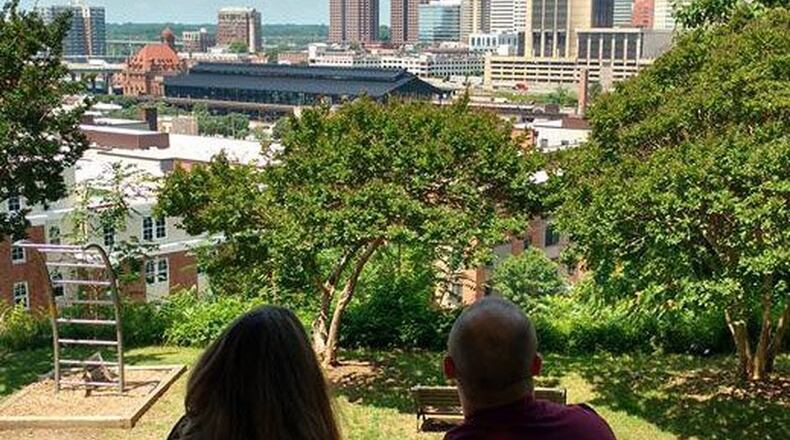 A couple of AmeriVespa 2018 participants admire the Richmond, Virginia, skyline during a Seven Hills of Richmond guided tour. Photo contributed by Gary Honnert