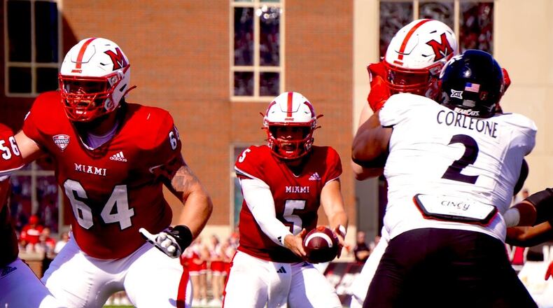 Miami's Brett Gabbert takes a snap against Cincinnati on Saturday. Chris Vogt/CONTRIBUTED