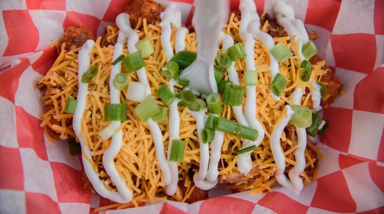 The Crazy Redhead Canteen was one of more than 50 trucks participated in last year's Miami County Gourmet Food Truck Rally. They specialize in loaded tater tots and decadent grilled cheese sandwiches. PHOTO / TOM GILLIAM PHOTOGRAPHY