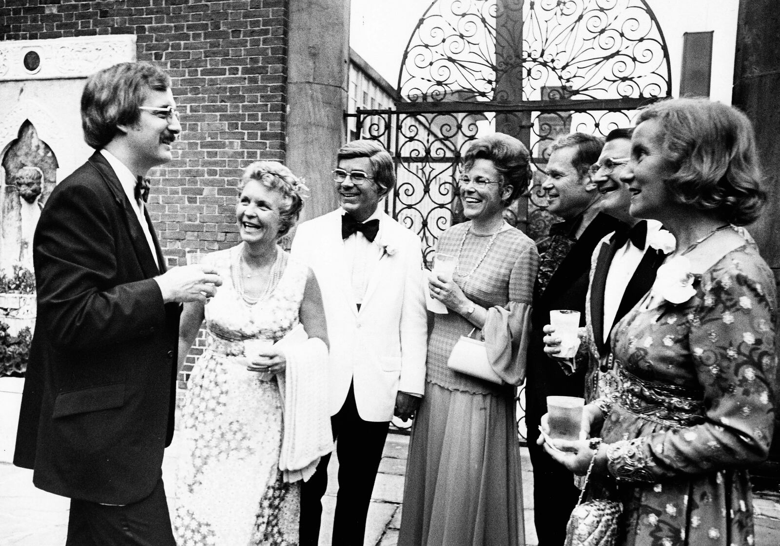 Dayton Art Institute director Bruce Evans, left,  greets Art Ball guests Dr. and Mrs. Peter King, Dr. and Mrs. James Appleton and Dr. and Mrs. Ludolph van der Hoeven at the 1974 Art Ball. DAYTON DAILY NEWS ARCHIVE