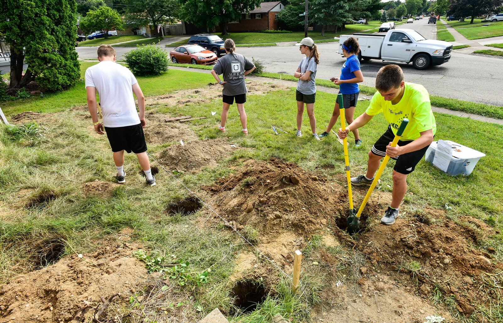 Left to right: Zavier Poole, 14, from Indiana, group leader Laura Hundley, from South Carolina, Madelyn Stewart, 15, from North Carolina, Maddison Surles, 15, from Oklahoma, and Zach Rice, 17, from Illinois, work to build a wheelchair ramp Tuesday, June 26, at a home on Hammond Boulevard for the Group Work Camps this week. 