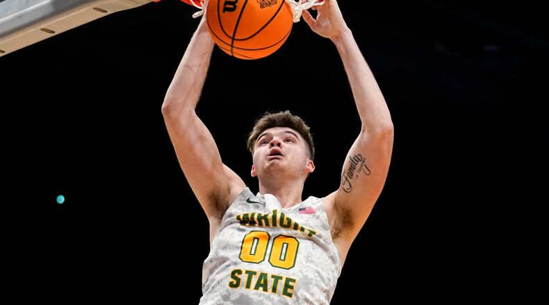 Wright State forward Grant Basile (0) dunks during the second half of a First Four game in the NCAA men's college basketball tournament against Bryant, Wednesday, March 16, 2022, in Dayton, Ohio. (AP Photo/Jeff Dean)