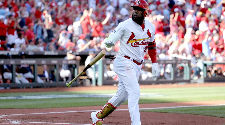 ST LOUIS, MISSOURI - OCTOBER 07:  Marcell Ozuna #23 of the St. Louis Cardinals hits his second solo home run of the game, against the Atlanta Braves during the fourth inning in game four of the National League Division Series at Busch Stadium on October 07, 2019 in St Louis, Missouri. (Photo by Scott Kane/Getty Images)
