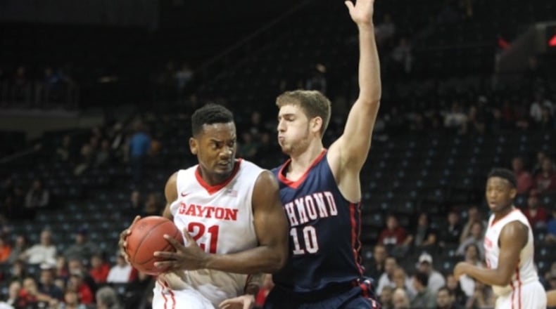 Dayton’s Dyhshawn Pierre drives to the basket past Richmond’s T.J. Cline in the first half. David Jablonski/Staff