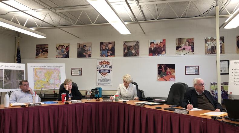 The Lebanon school board listens as a resident questions the leadership of Superintendent Todd Yohey. STAFF/LAWRENCE BUDD