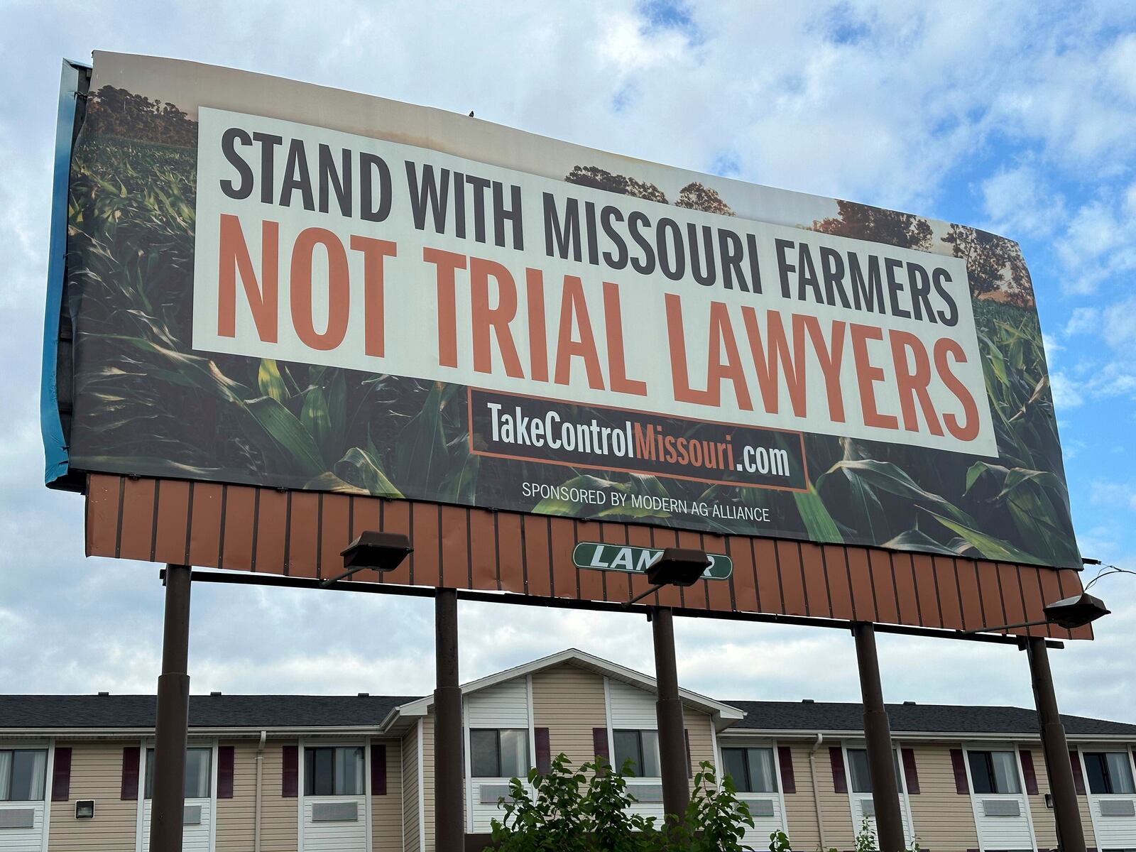 FILE - A billboard supporting legislation that would provide legal protection to manufacturers of pesticides such as Bayer's popular weedkiller Roundup, is shown in Jefferson City, Mo., May 13, 2024. (AP Photo/David A. Lieb, File)