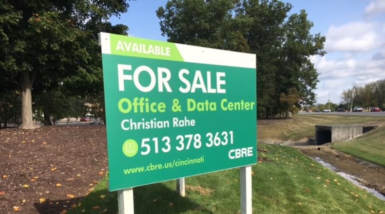 A CBRE "for sale" sign is posted at an entrance to the LexisNexis campus in Miami Twp. THOAMS GNAU/STAFF