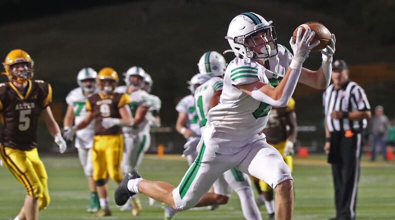 Badin's Quinn Brennan catches a touchdown pass during Friday's game against Alter at Centervilley High School. Bill Lackey/STAFF