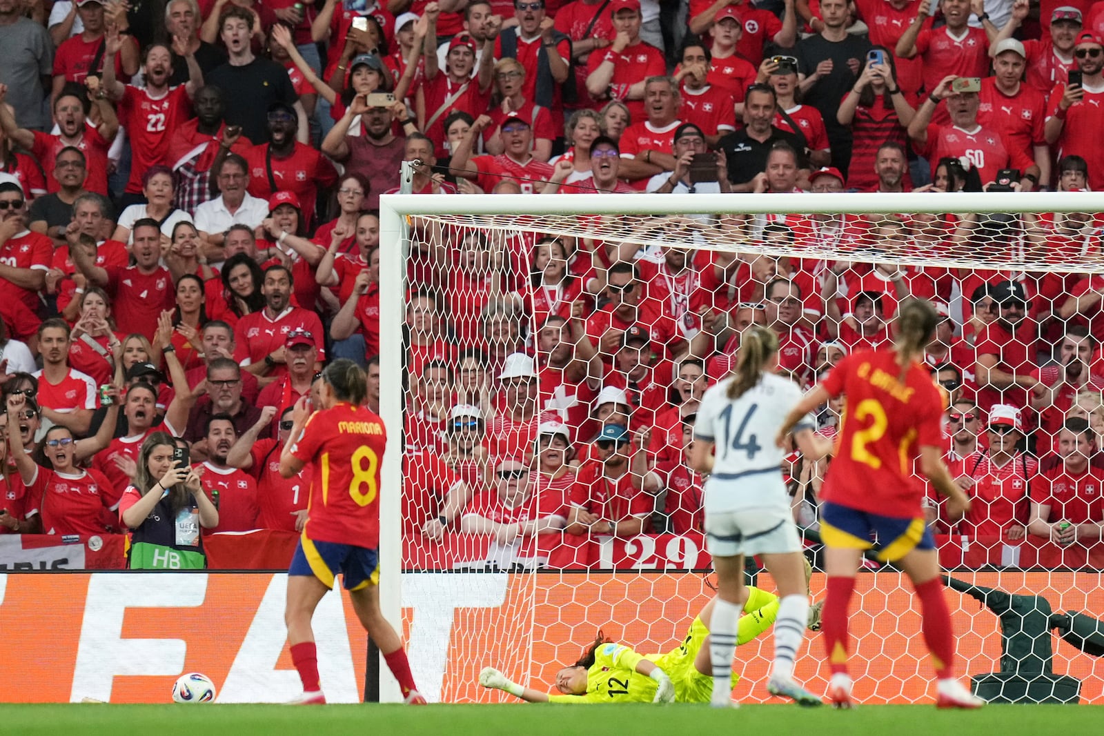 Switzerland fans react after Spain's Mariona Caldentey, left, failed to score a penalty shot during the Women's Euro 2025 quarterfinals soccer match between Spain and Switzerland at Stadion Wankdorf in Bern, Switzerland, Friday, July 18, 2025. (AP Photo/Alessandra Tarantino)