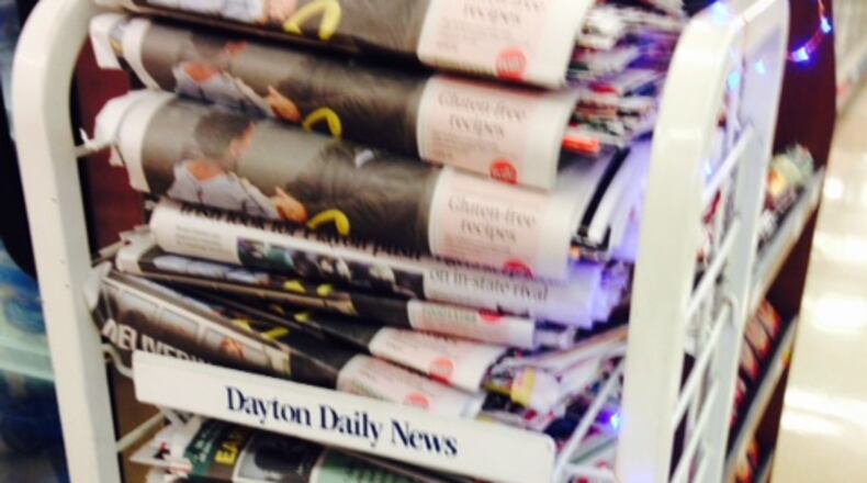 Early Thanksgiving Day editions of the Dayton Daily News are available now at locations including Dorothy Lane Market in Oakwood and Kroger on Wayne Avenue in Dayton. Staff photo by Barbara Kedziora.