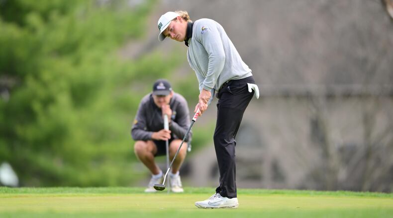 Wright State University golfer Andrew Flynn putts at the WSU Invitational on April 14 at Heatherwoode Golf Club in Springboro. JOE CRAVEN / CONTRIBUTED PHOTO