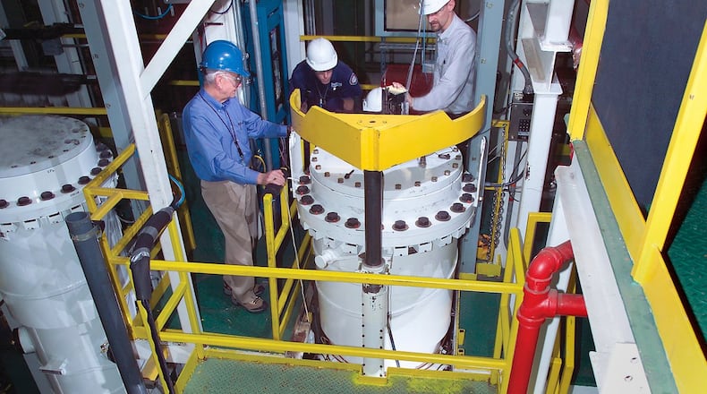 USEC employees test individual centrifuge machines during the spring of 2005 in Oak Ridge in preparation for testing numbers of centrifuges in a cascade formation in Piketon. The project later lost federal funding. USEC Inc. photo