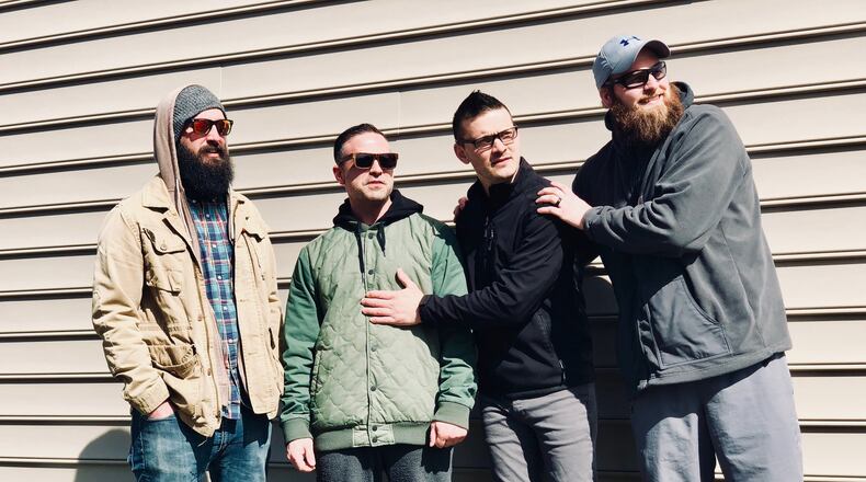 Aaron Zurn (far right) is battling Post-Traumatic Stress Disorder with the musical assistance of bandmates (left to right) Jon Becker, Robert Grote and Ben Willis of the group Stailer, presenting a benefit for Operation Finally Home at Amvets Post 99 in Vandalia on Saturday, April 28. CONTRIBUTED