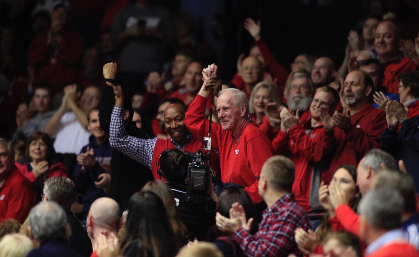 PHOTOS FROM THE BOOK: The Epicenter of College Basketball: A History of UD Arena — Dayton basketball great Johnny Davis and his former coach, Don Donoher, the winningest coach in program history, are honored during a game against East Tennessee State in 2016 at UD Arena. Dayton Daily News photo by David Jablonski