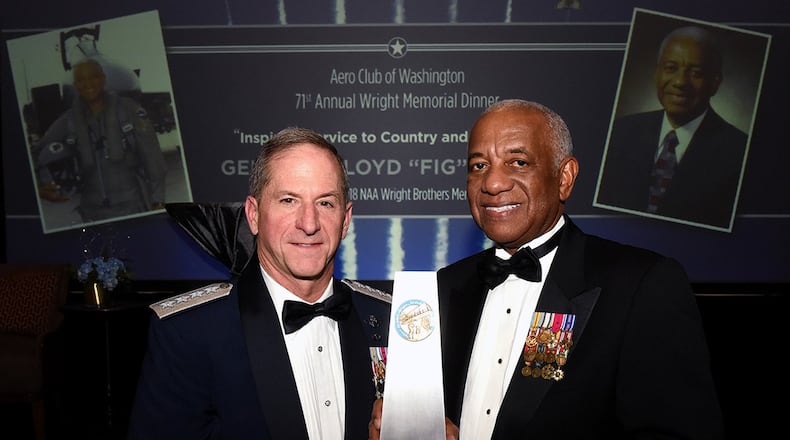 Air Force Chief of Staff Gen. David L. Goldfein and retired Gen. Lloyd Newton, the 2018 Wright Brothers Memorial Trophy winner, pose for a photo after the 71st National Aeronautics Association Wright Brothers Memorial Dinner in Washington, D.C., Dec. 14. (U.S. Air Force photo/Staff Sgt. Rusty Frank)