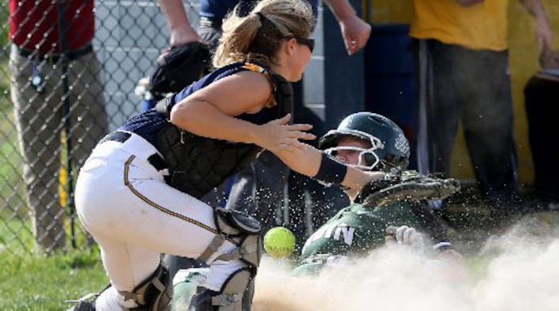 Badin base runner Samantha Sander scores on Monroe catcher Sarah Eschmeyer. E.L. HUBBARD PHOTO