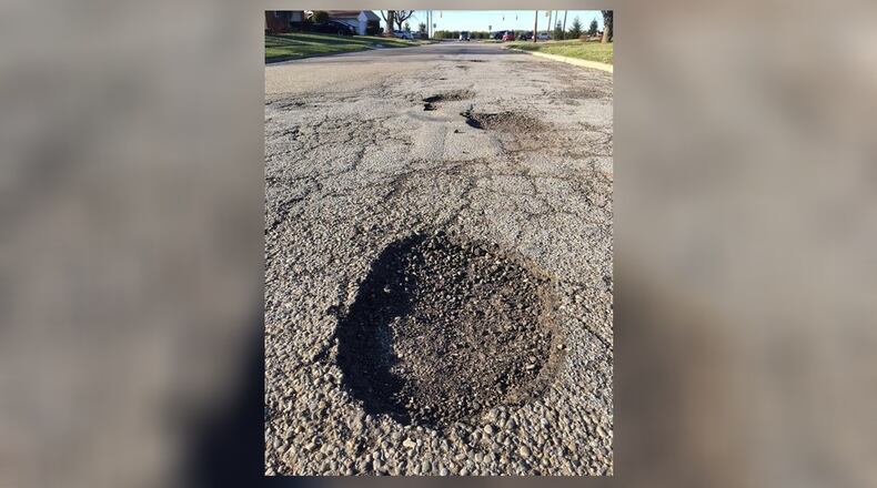 Colorado Drive is among Xenia’s streets in dire need of new pavement. RICHARD WILSON/STAFF