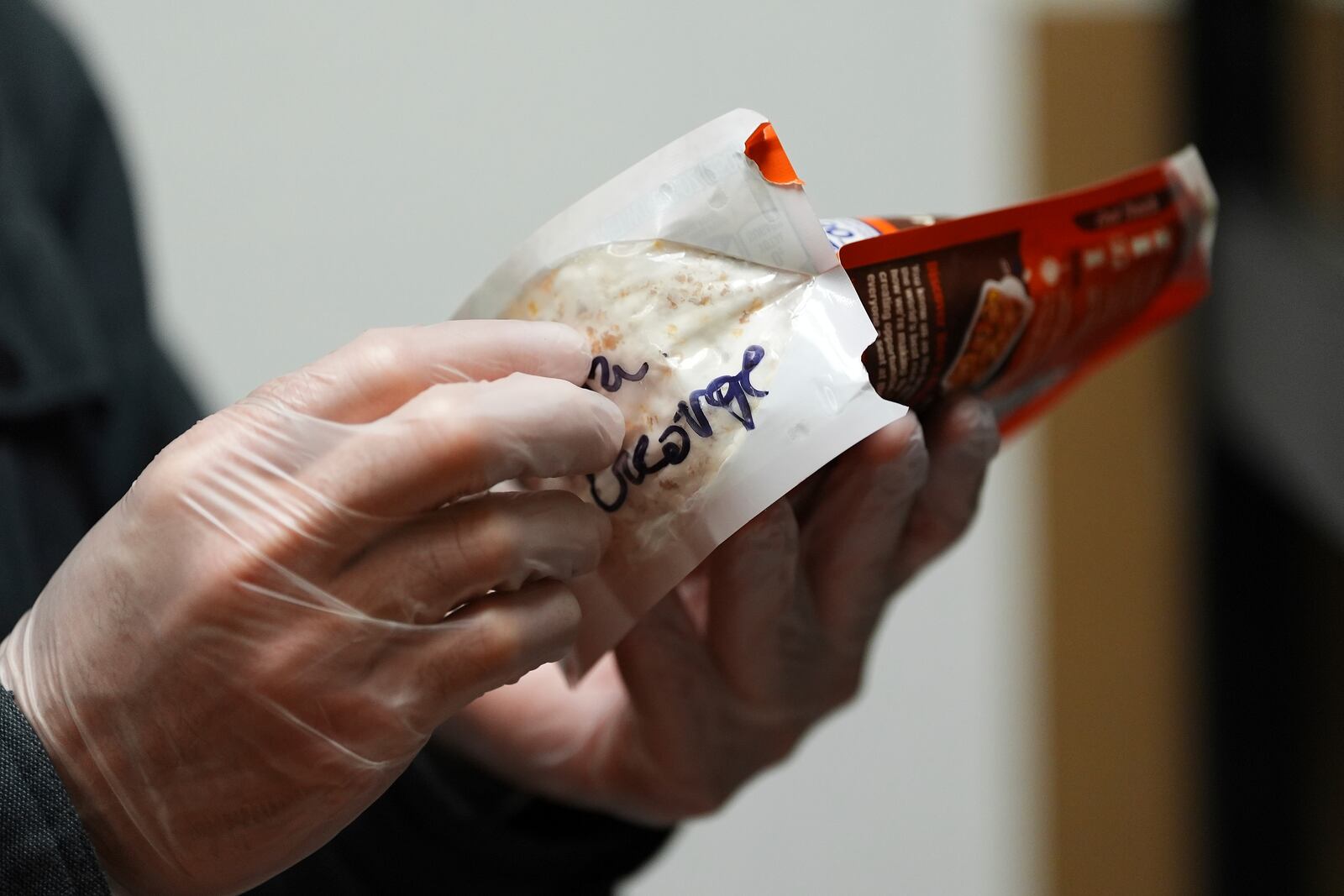 Matt Metzger, a Marine Corps combat veteran, displays an instant rice bag used to grow mushrooms for microdosing psilocybin Wednesday, March 26, 2025, in Olympia, Wash. (AP Photo/Lindsey Wasson)