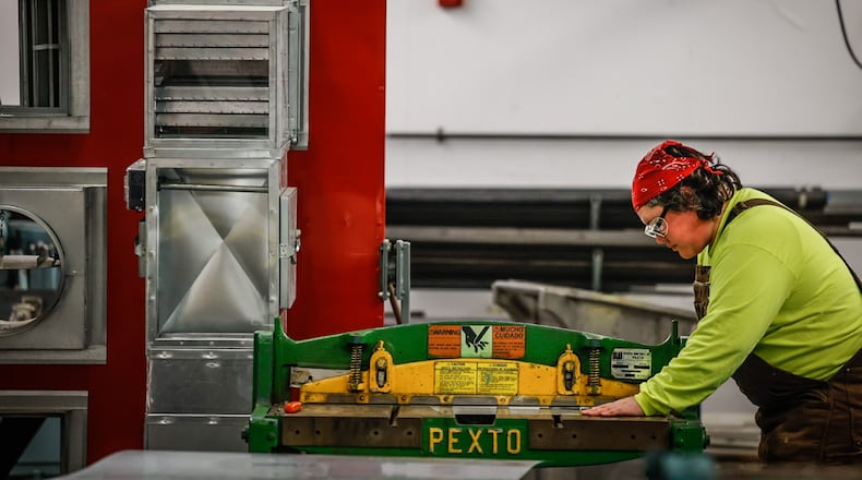 Santana Austin, 31, and a second year sheet metal apprentice works on a project at sheet metal local 24 union on Poe Ave. Wednesday November 16, 2022. JIM NOELKER/STAFF