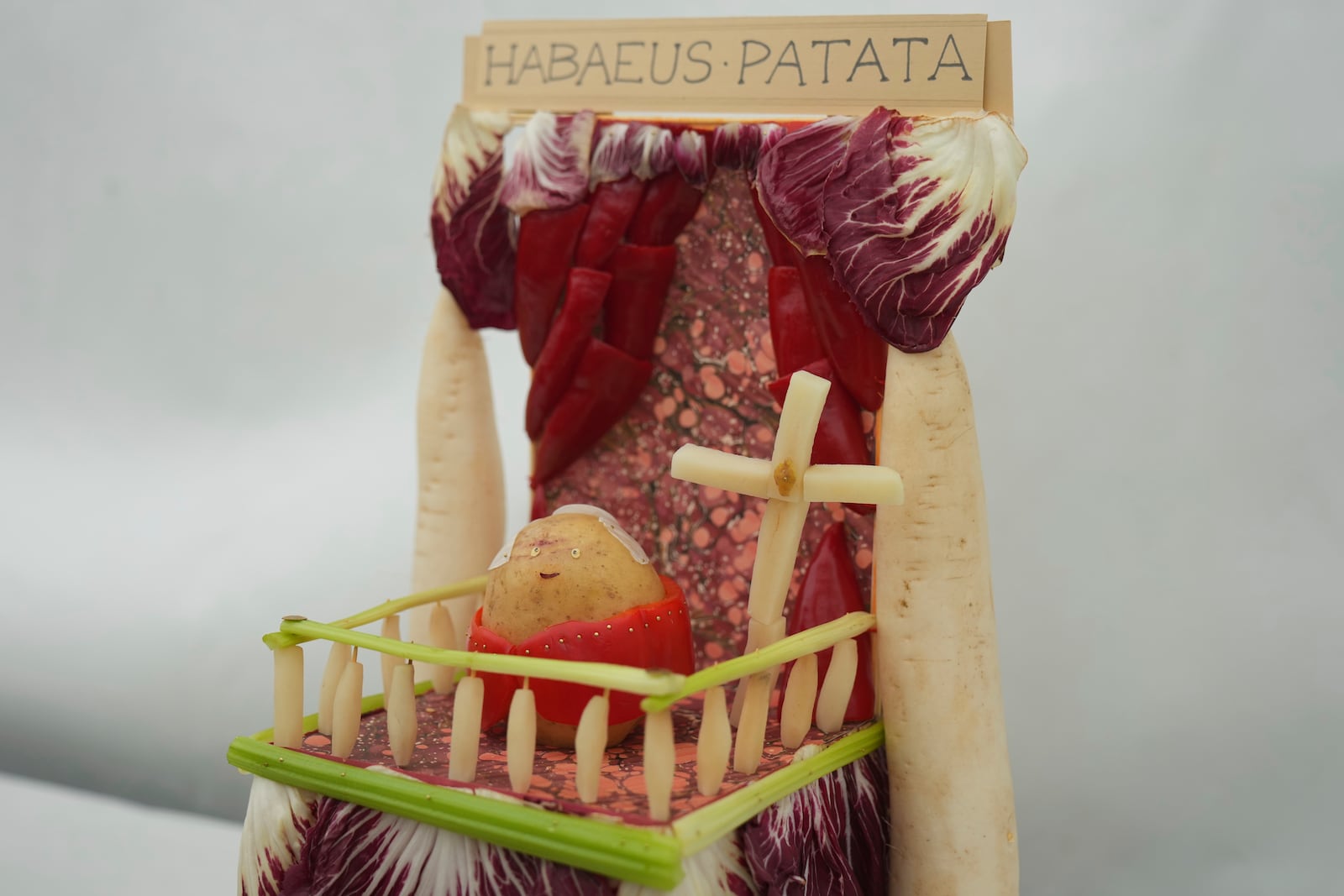 A vegetable sculpture entitled 'Habaeus Patata enters in the vegetable sculpture competition at Lambeth County show in London, Saturday, June 7, 2025. (AP Photo/Joanna Chan)
