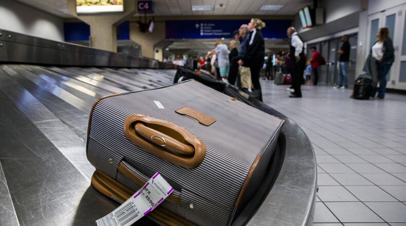 Luggage circles a baggage claim at Gate C on March 10, 2017, at DFW International Airport in Dallas. (Ashley Landis/Dallas Morning News/TNS)