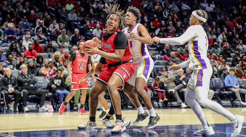 Trotwood Madison High School senior Jermiel Atkins drives to the hoop during their Division III regional final game against Cincinnati Aiken on Sunday afternoon at the Xavier University Cintas Center. Aiken won 71-50. Michael Cooper/STAFFMichael Cooper/STAFF